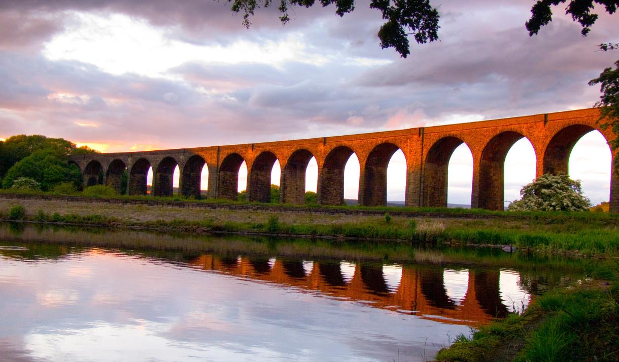 View of Hewenden Viaduct at sunset.