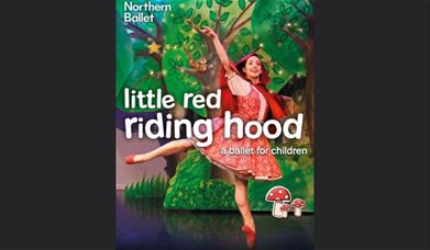 A picture of a ballerina portraying Little Red Riding Hood