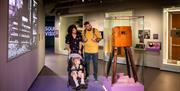 Family exploring the NSMM Galleries.