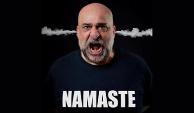 A picture of comedian Omid Djalili, with steam coming out of his ears