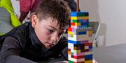 A child playing with Lego