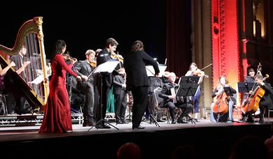 Full orchestra playing music.
