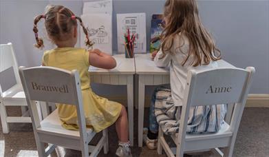 Children sat at a desk