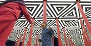 Child playing in mirror maze in Wonderlab © Science Museum Group