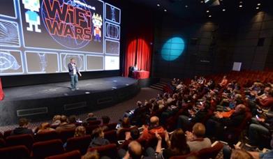 A person speaking to an audience